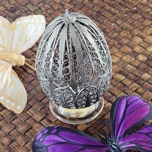 Metal cutout egg ornament collectables. With stand